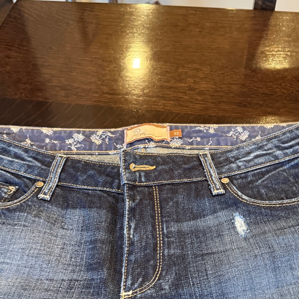 PAIGE dark denim distressed jeans.